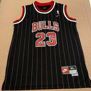 Nike, Chicago Bulls Basketball Jersey (Michael Jordan 23). Black + red.